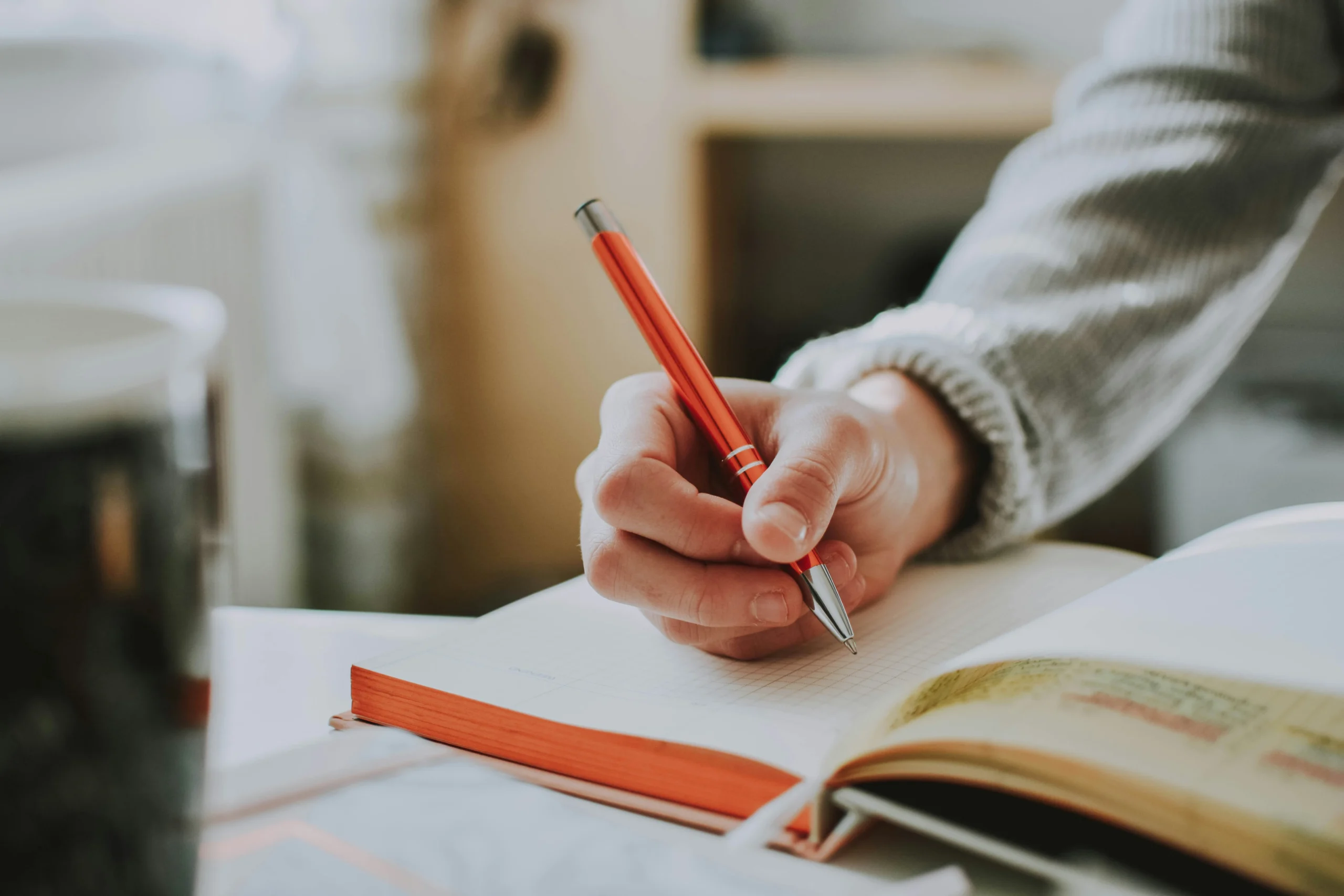 Person journaling as part of a daily self improvement routine